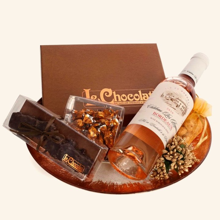 One of our Purim gift platters with a gift box, wine and chocolates